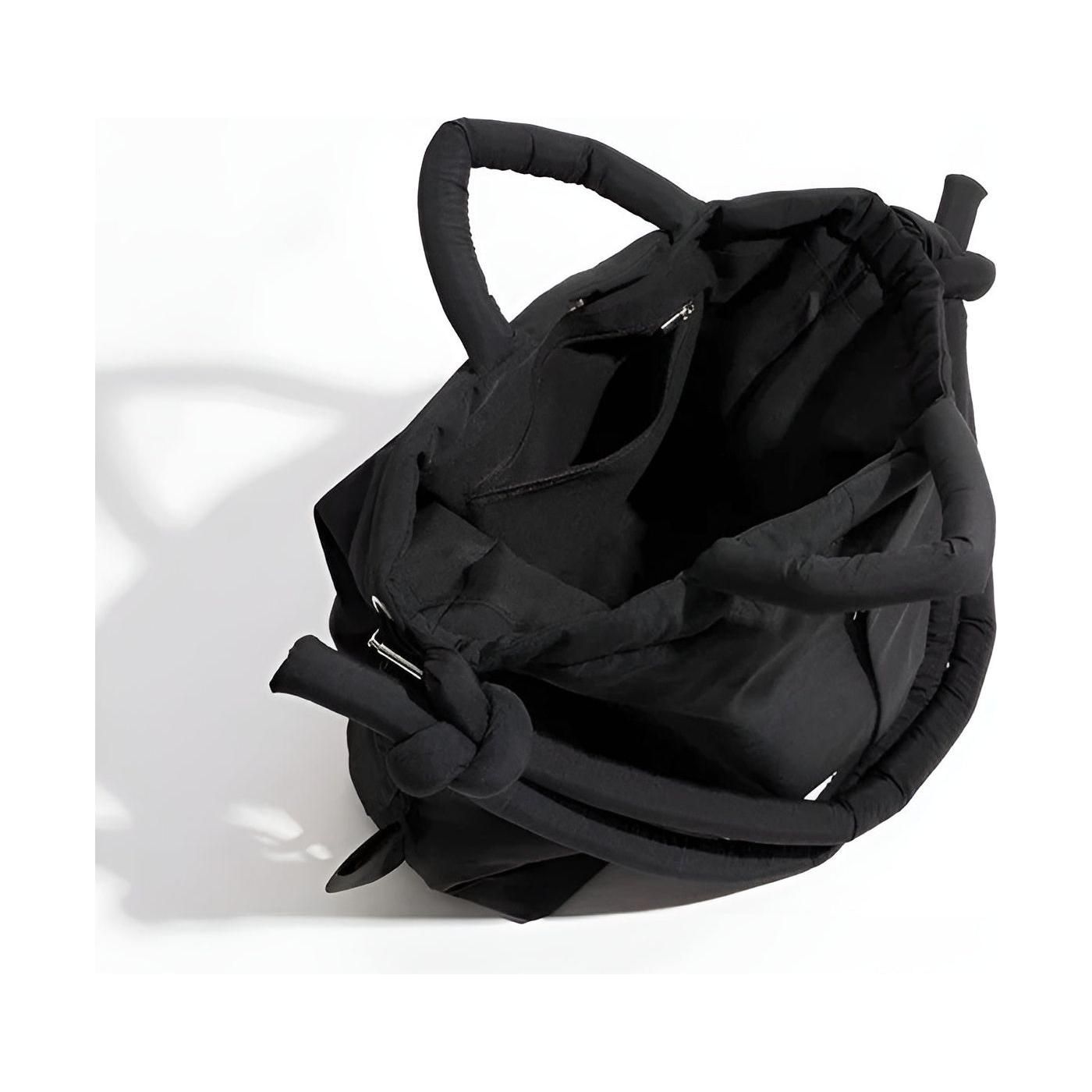 Knottia – Stilfuld håndtaske med unikt knyttet håndtag og justerbar rem