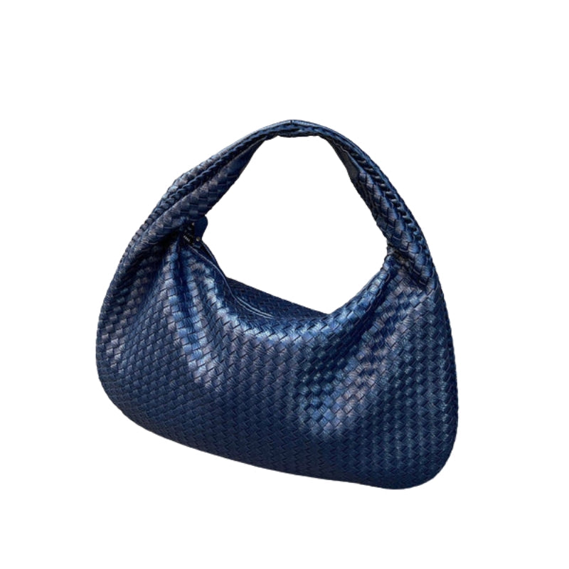 Talira – Chic mulepose med tophåndtag med ikonisk lås og strømlinet interiør