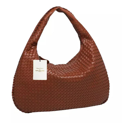 Talira – Chic mulepose med tophåndtag med ikonisk lås og strømlinet interiør