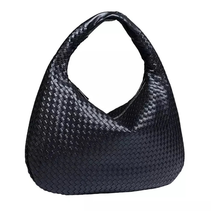 Talira – Chic mulepose med tophåndtag med ikonisk lås og strømlinet interiør